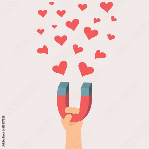 hand holding magnet attracts symbol hearts, Love concept.