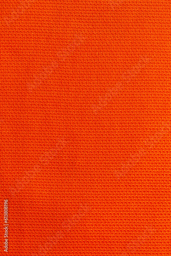 Orange color sports clothing fabric football shirt jersey texture and textile background. © Southtownboy Studio