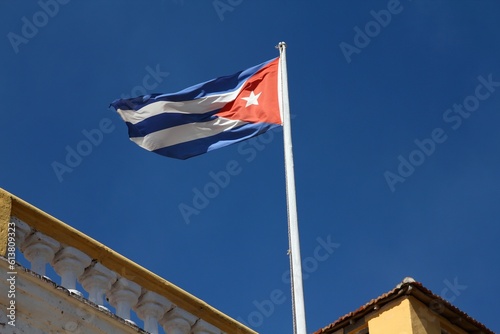 Flag of Cuba in the wind in Trinidad town hall, Cuba.