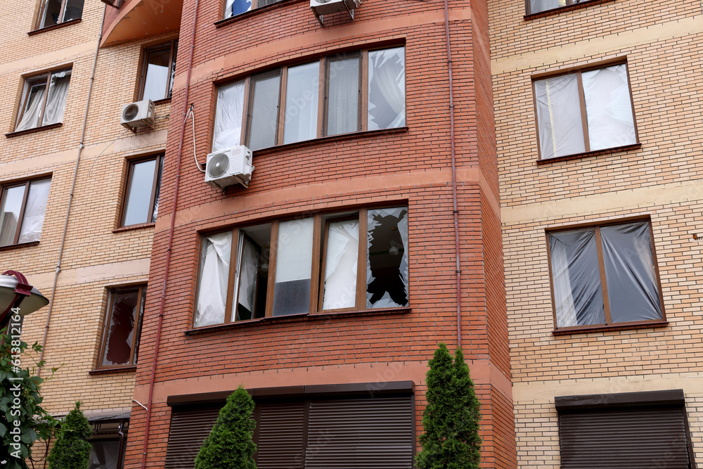 War between Ukraine and Russia. Shell fragments damaged the Business center and residential buildings. Damaged facade, broken windows of the house.