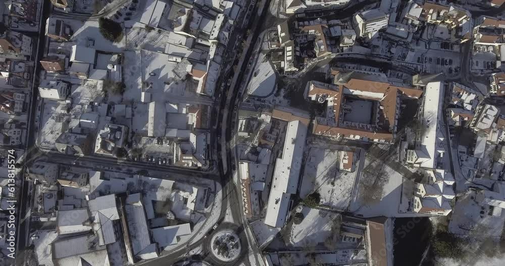 Aerial view from above, over a german town in hesse in winter with snow-covered houses. Aerial view from above, over a german town in hesse in winter with snow-covered houses.