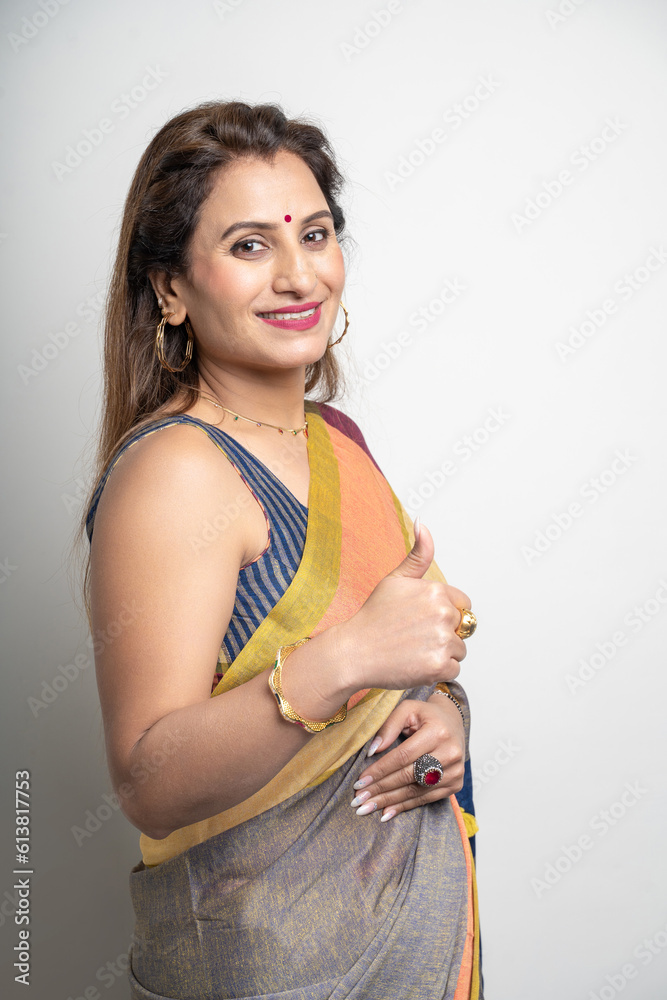 indian woman wearing traditional sari and showing thumps up. indian woman wearing traditional sari and showing thumps up.