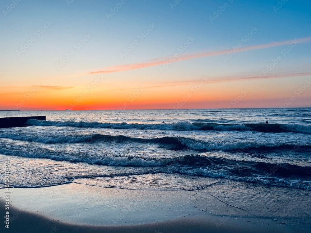 Orange sea coast, twilights at the sea, sandy coastline, natural evening seascape background