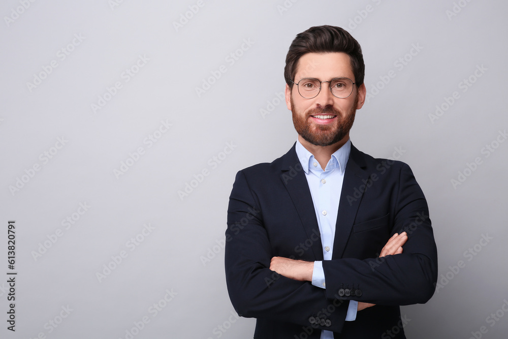 Portrait of handsome man in glasses on light grey background, space for text Portrait of handsome man in glasses on light grey background, space for text