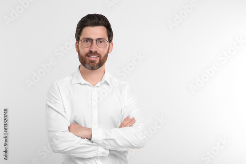 Portrait of handsome man in glasses on white background. Space for text © New Africa