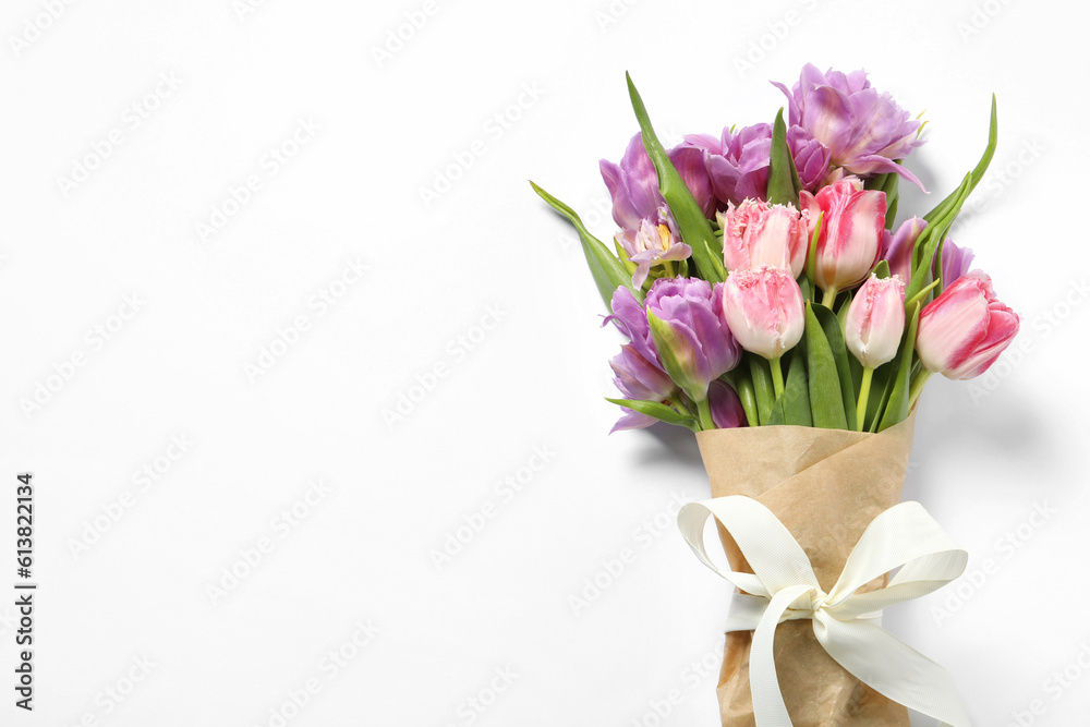 Beautiful bouquet of colorful tulip flowers on white background, top view. Space for text