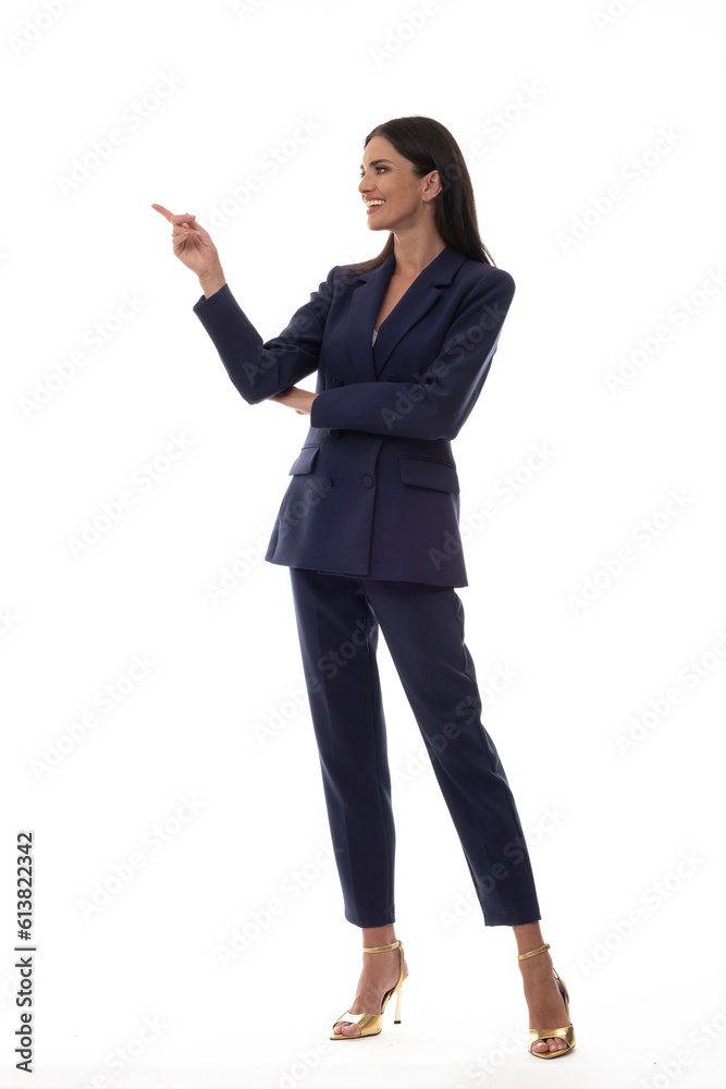 Beautiful woman in an elegant suit on a white background in a photo studio. Beautiful woman in an elegant suit on a white background in a photo studio.