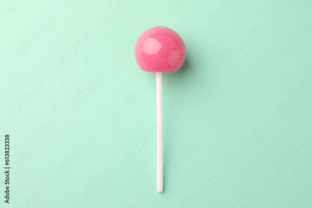 Tasty lollipop on turquoise background, top view Tasty lollipop on turquoise background, top view