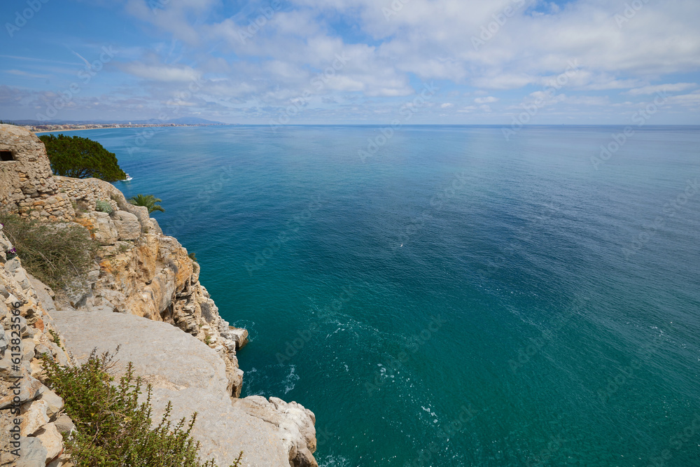 Fototapeta premium View of Mediterranean sea and small town on the cost.