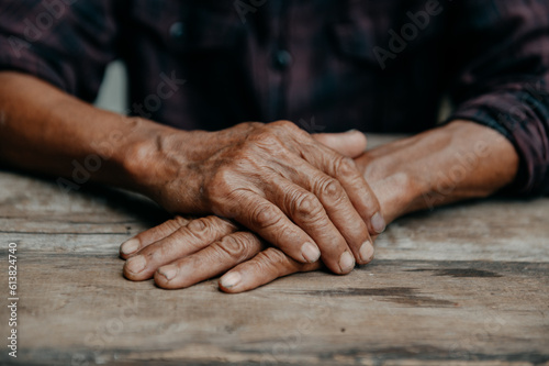 Male wrinkled hands, old man is wearing