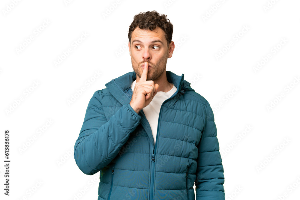 Brazilian man over isolated chroma key background showing a sign of silence gesture putting finger in mouth Brazilian man over isolated chroma key background showing a sign of silence gesture putting finger in mouth