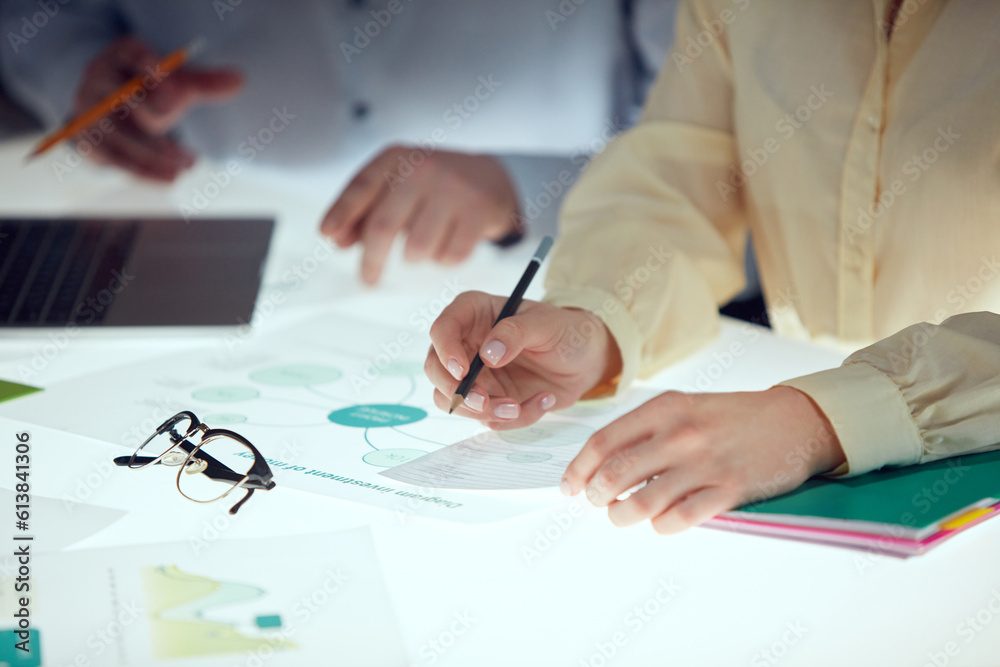 Man and woman are using gadgets and laptop, talking during the conference in office over meeting room background. Brainstorming Man and woman are using gadgets and laptop, talking during the conference in office over meeting room background. Brainstorming