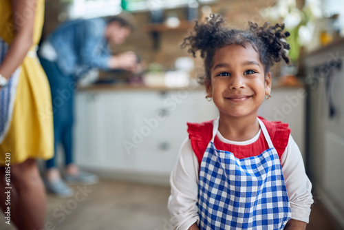 Pure Joy: Afro-American Girl Radiating Happiness in Kitchen Portrait