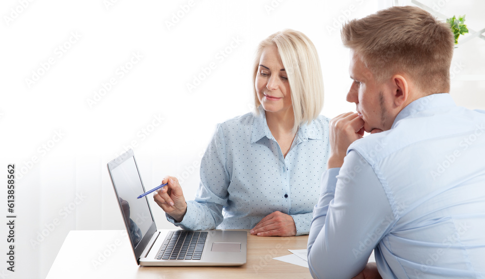 The female director advises a male manager on financial operations at the company. The female director advises a male manager on financial operations at the company.