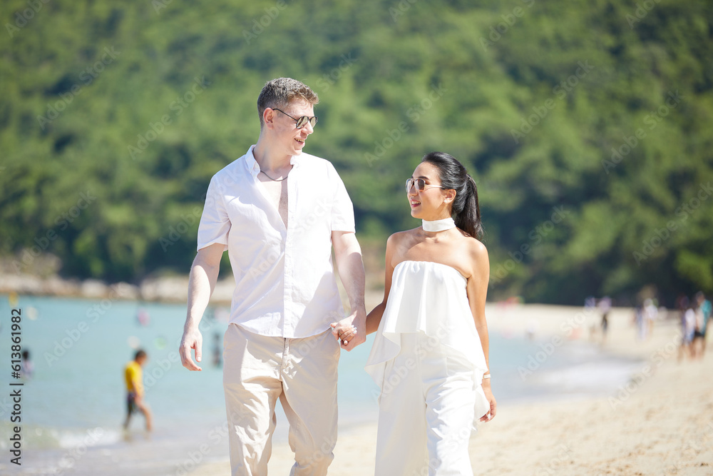 young couple walking on the beach and enjoy to travel in summer young couple walking on the beach and enjoy to travel in summer