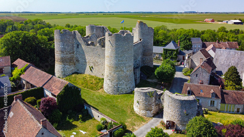 Aerial view of the medieval castle of Yèvre le Châtel in the French department of Loiret - Enclosure with 4 round towers at the top of a hill in a rural village photo