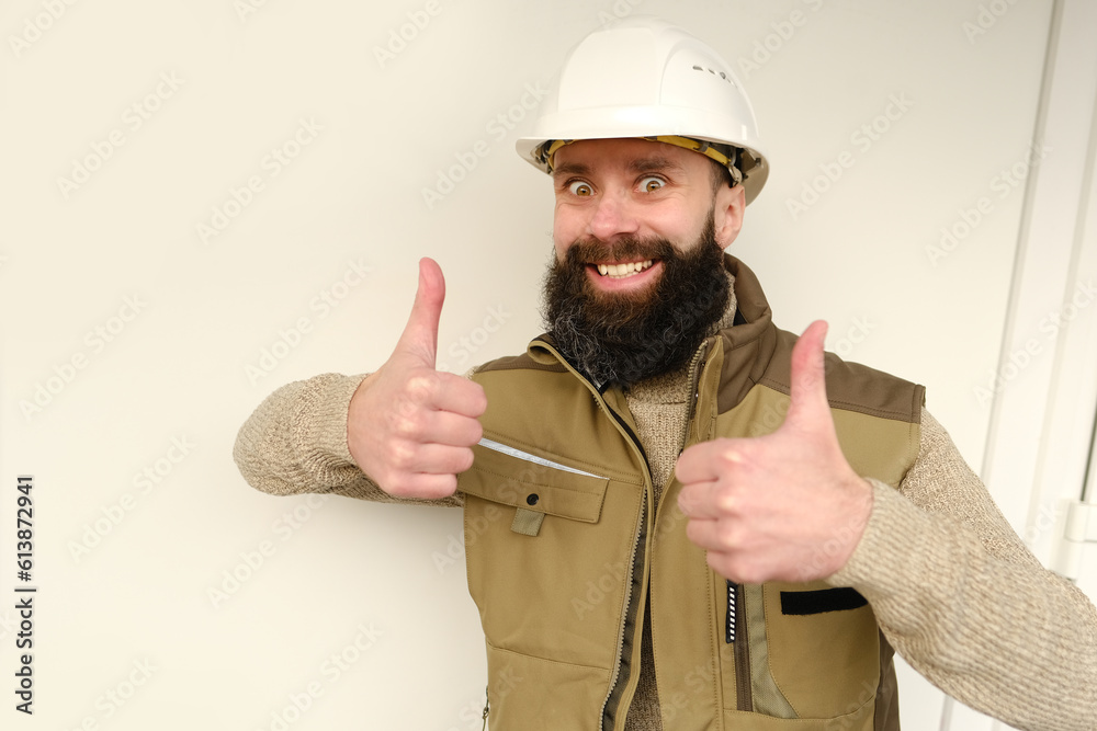 professional happy smiling male worker or builder in helmet showing thumbs up, bearded man in uniform, construction worker, contractor or architect on building site, inspect performance of project professional happy smiling male worker or builder in helmet showing thumbs up, bearded man in uniform, construction worker, contractor or architect on building site, inspect performance of project