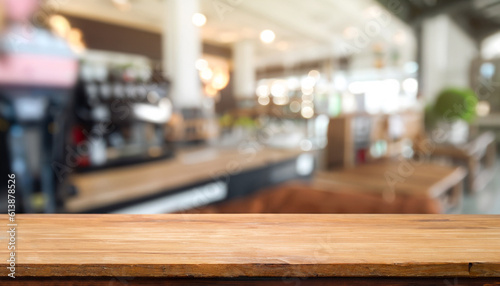 Selected focus empty brown wooden table and Coffee shop blur background with bokeh image. for your photomontage or product display.