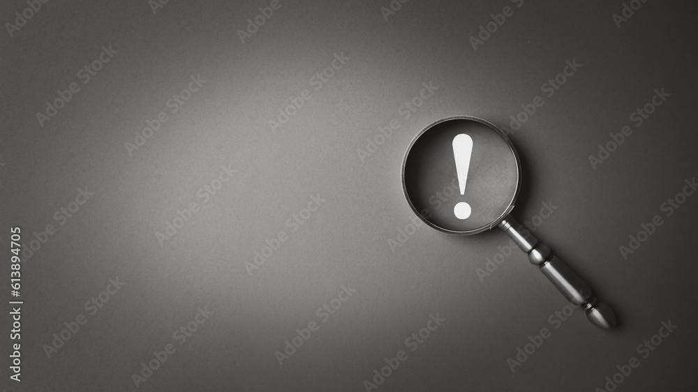 Black and white magnifier magnifying exclamation mark gray background. Alert and precaution concept. Caution and risk management security signal announcement hazard and dangerous notice symbol - obrazy, fototapety, plakaty 