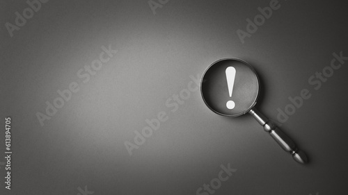 Black and white magnifier magnifying exclamation mark gray background. Alert and precaution concept. Caution and risk management security signal announcement hazard and dangerous notice symbol