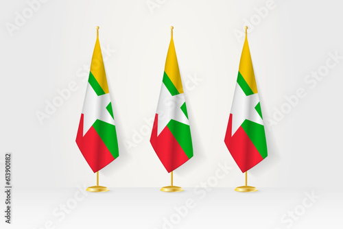 Three Myanmar flags in a row on a golden stand, illustration of press conference and other meetings.