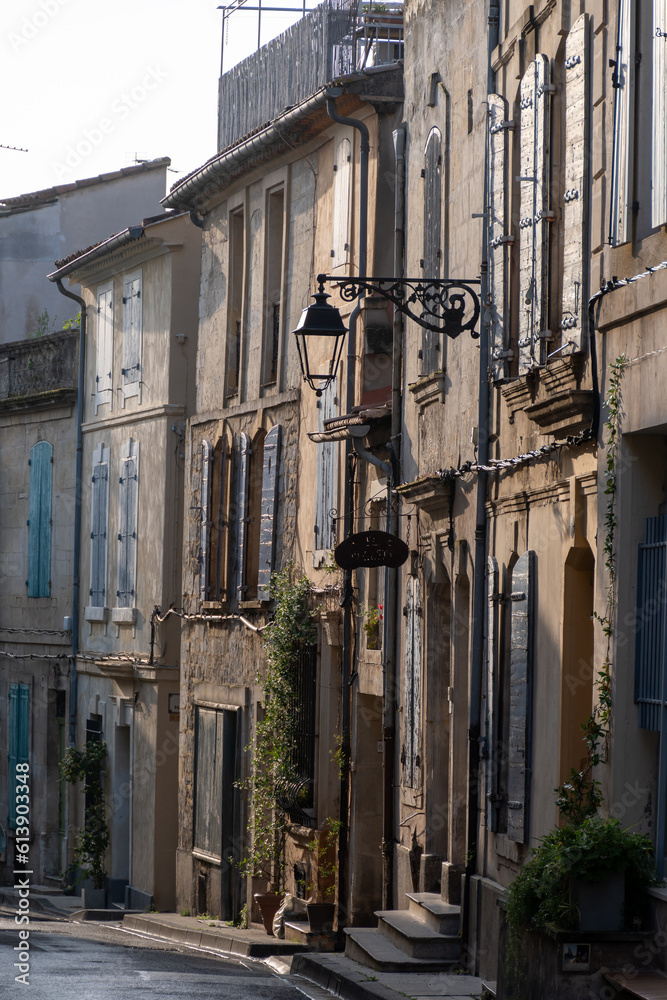 View on old streets and houses in ancient french town Arles, touristic destination with Roman ruines, Bouches-du-Rhone, France