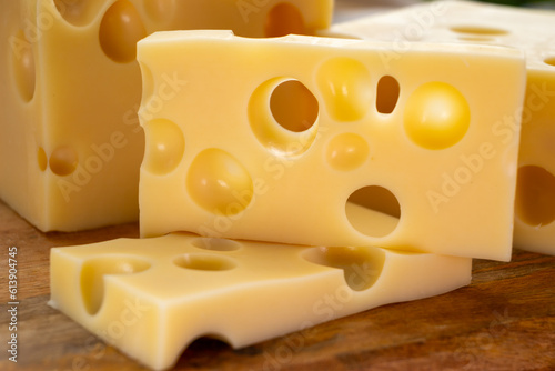 Foto Cheese collection, french hard cheese with holes emmentaler close up