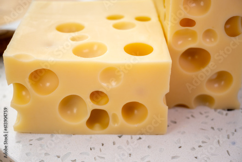 Cheese collection, french hard cheese with holes emmentaler close up