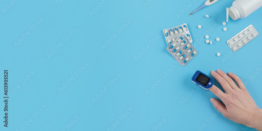 Pulse oximeter on finger to measure pulse rate and blood oxygen saturation level to check lungs