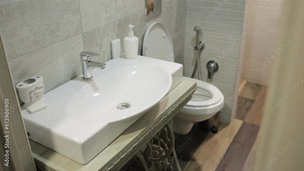 Beautiful public toilet interior. Mirror on the wall and washbasin. Loft style interior. Beautiful public toilet interior. Mirror on the wall and washbasin. Loft style interior.