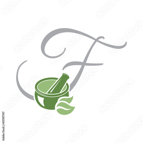 Mortar and pestle with letter f