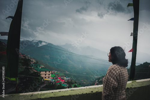 Fotografija Girl looking at the mountains during a rainy day – Sanjauli Shimla, Himachal Pra