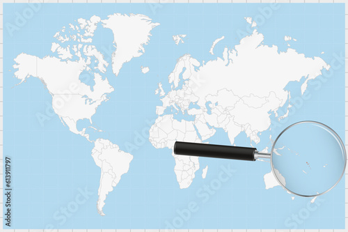 Magnifying glass showing a map of Vanuatu on a world map.