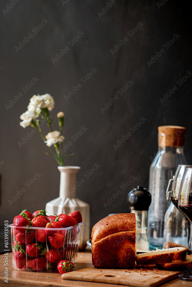 fresh strawberries and wine on kitchen