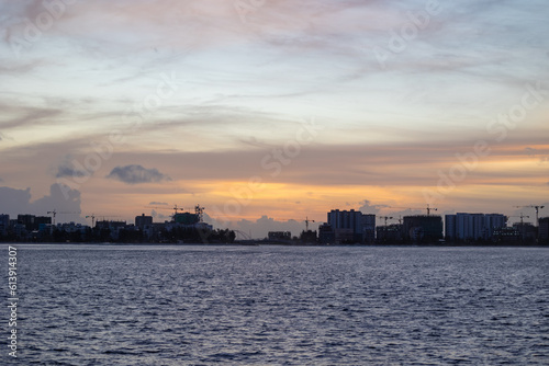 Huge buildings with sunset or sunrise, with sky and sea in a tropical island | Hiyaa flat of Maldives