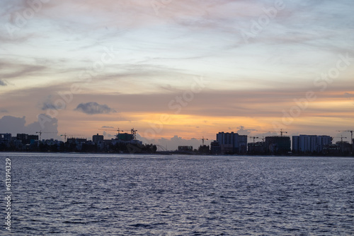 Huge buildings with sunset or sunrise, with sky and sea in a tropical island   Hiyaa flat of Maldives © Coverage Studio