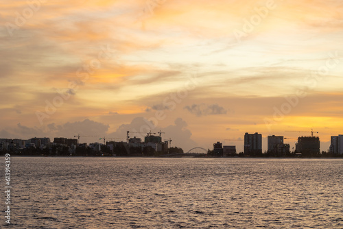 Huge buildings with sunset or sunrise, with sky and sea in a tropical island   Hiyaa flat of Maldives © Coverage Studio