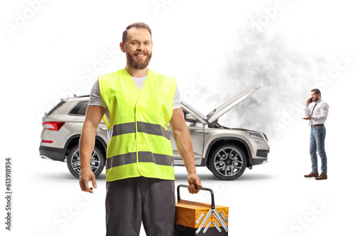 Man with a broken car calling a road assistance worker © Ljupco Smokovski