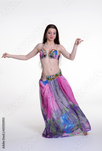 Belly dancer woman studio photography, belly dance is an art form of the dance.