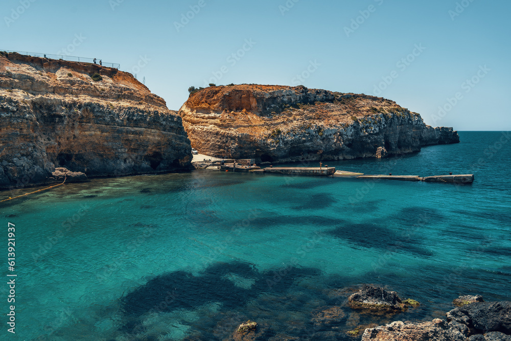 coast of malta island with blue water