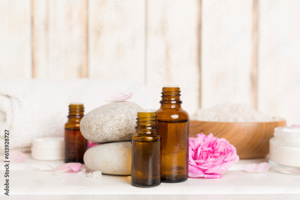 Spa composition with pink roses on wooden table Spa composition with pink roses on wooden table
