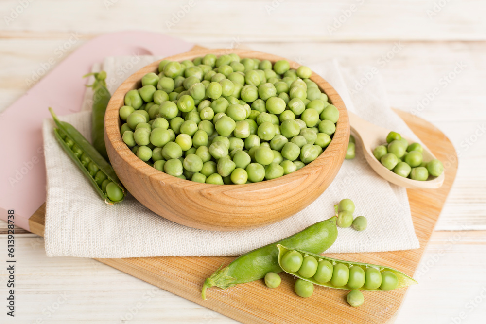 Composition with fresh green peas on wooden table Composition with fresh green peas on wooden table