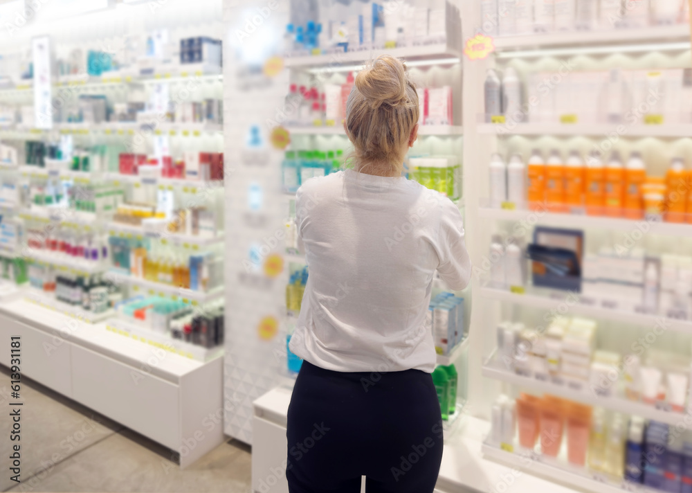 buying make up at cosmetics section in store. choosing cosmetics, perfumes, creams and shampoos, Using tester. buying make up at cosmetics section in store. choosing cosmetics, perfumes, creams and shampoos, Using tester.