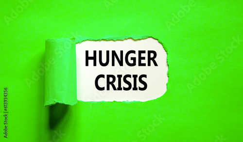 Hunger crisis symbol. Concept words Hunger crisis on beautiful white paper on a beautiful green background. Business, support and Hunger crisis concept. Copy space.