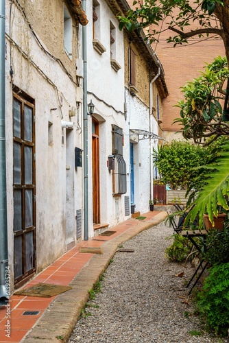 Quiet residential street lined with charming architecture and greenery. Badalona  Spain