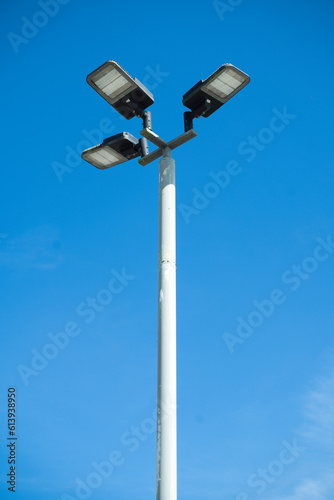 street led lamp post or lantern on a blue sky background.