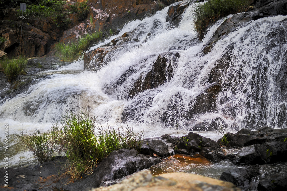 powerful wide waterfall with white foaming water powerful wide waterfall with white foaming water