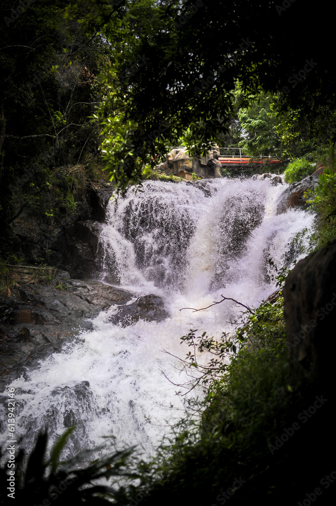 powerful wide waterfall with white foaming water powerful wide waterfall with white foaming water