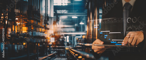 Manager Technical Industrial Engineer working and control robotics with schedule monitoring system software and icon industry network connection  tablet. AI, Artificial Intelligence, Automation robot.