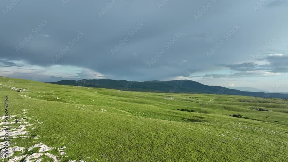 Aerial view of countryside landscape. Clouds with shades of purple, orange and green vegetation. Dramatic sky. Aerial view of countryside landscape. Clouds with shades of purple, orange and green vegetation. Dramatic sky.